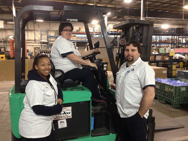 people at work in a warehouse